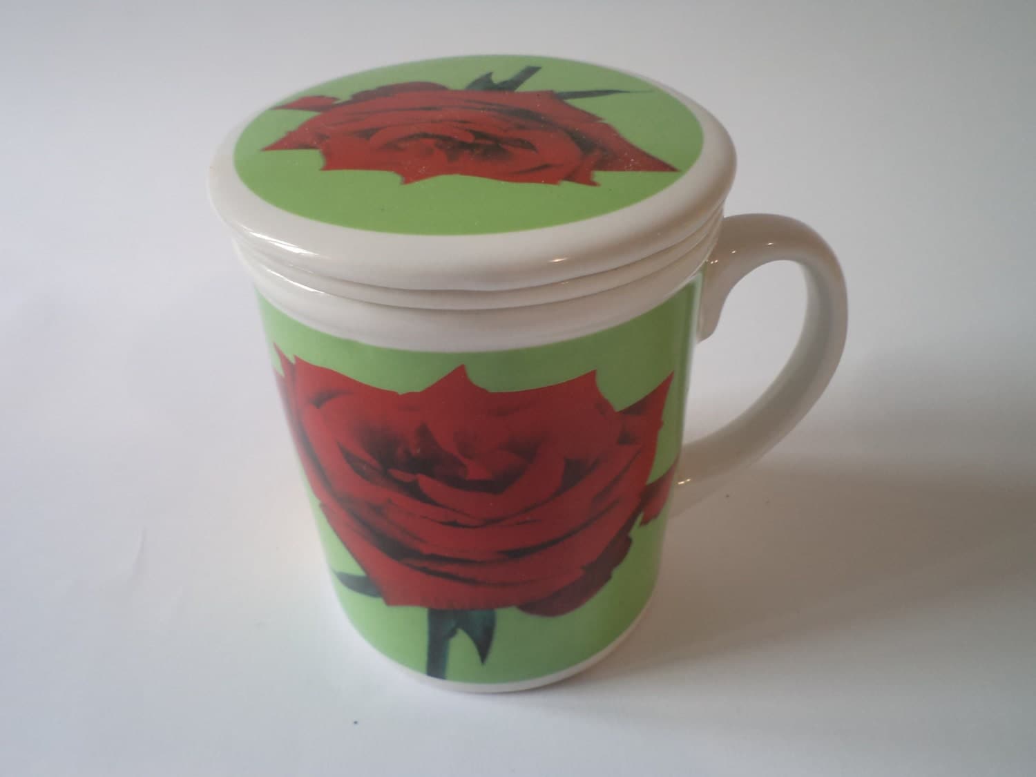 Vintage set of a ceramic tea Cup with a tea Strainer and a Lid, 1980s Haute Juice