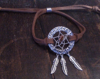 Hand made dreamcatcher bracelet / Silver coloured dreamcatcher bracelet with feather charms and brown suedine
