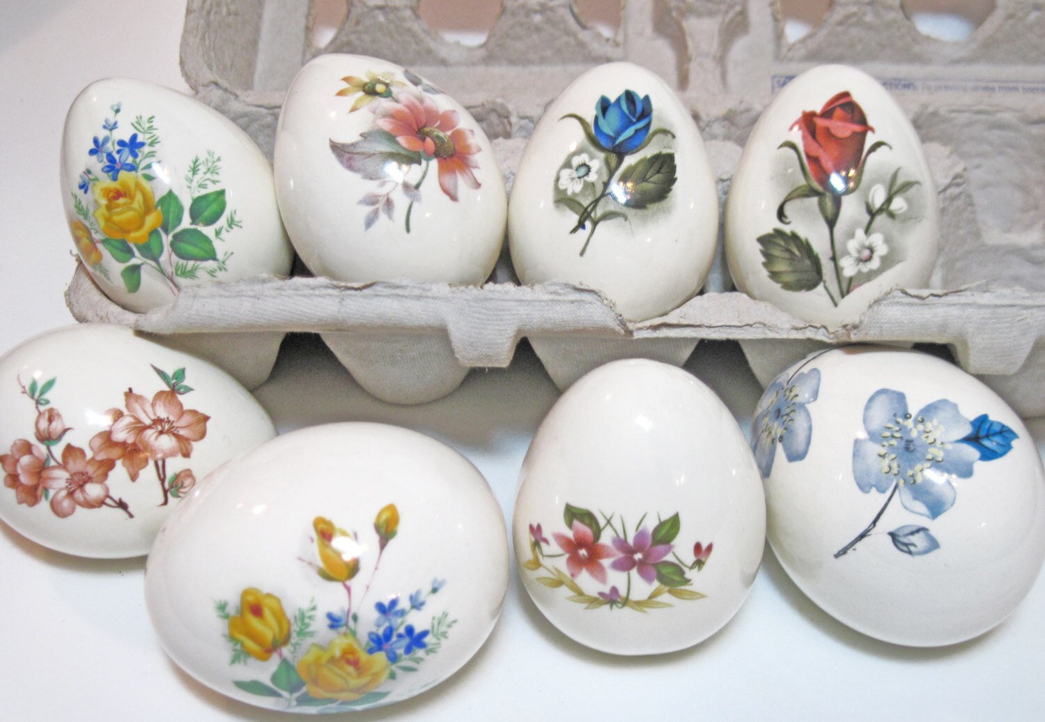 Set of Eight White Porcelain Eggs Painted or Decal with