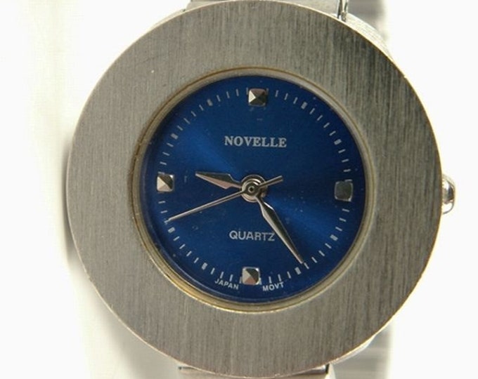 Storewide 25% Off SALE Vintage Silver Tone Ladies Novelle Designer Signed Art Deco Inspired Quartz Watch Featuring Round Dark Blue Bezel