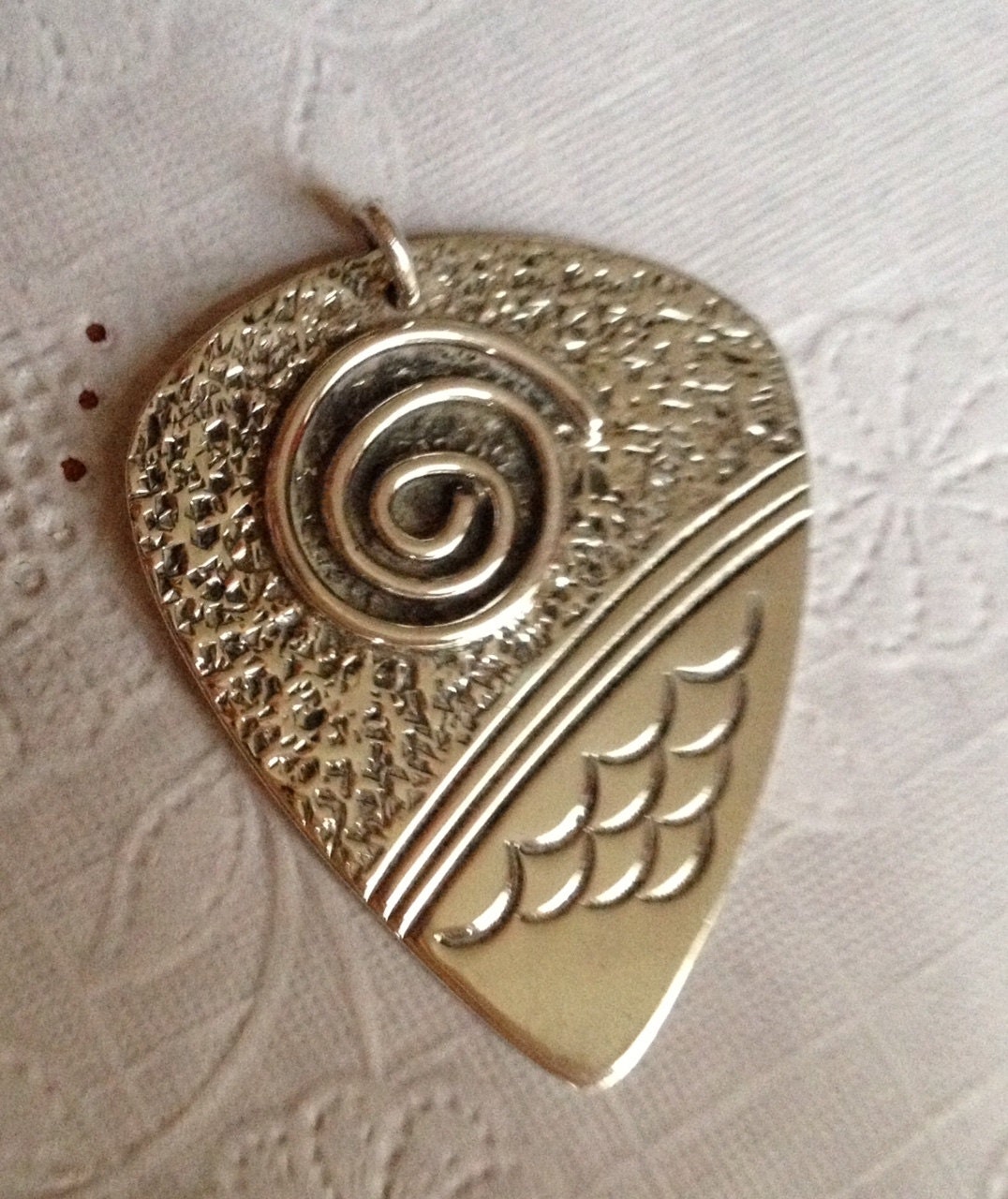 Southwestern Sterling Silver Guitar Pick Pendant by nekoblue