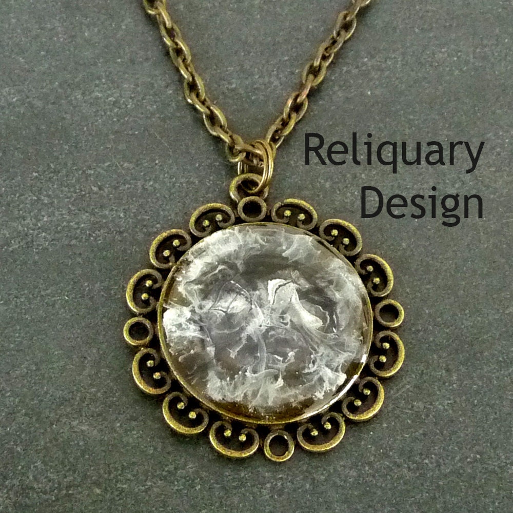 Resin pendant necklace / brass bezel filled by ReliquaryDesign
