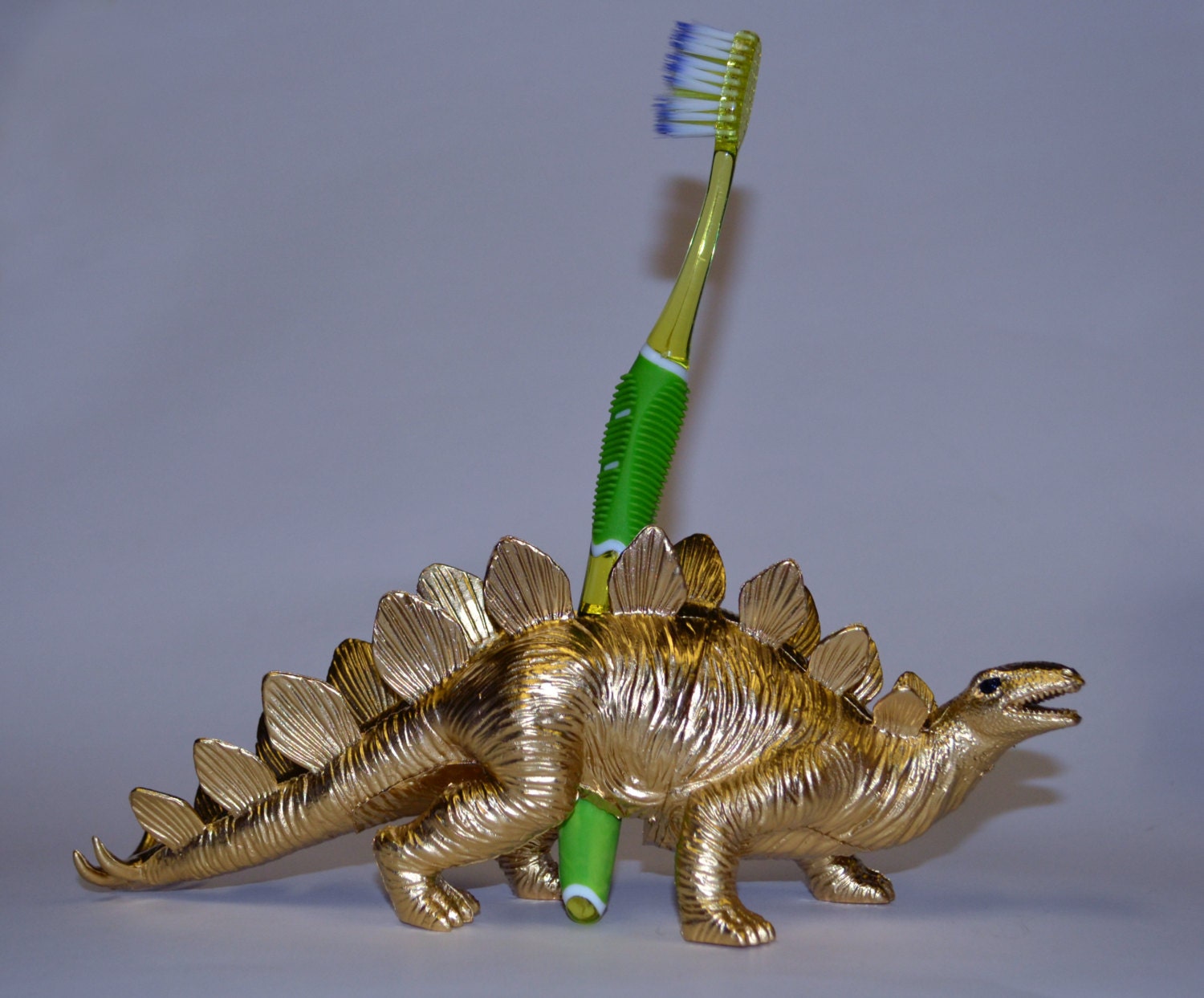 Dinosaur Toothbrush Holder Stegosaurus Gold Jurassic Park