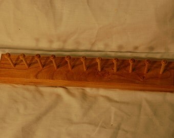 11-peg necktie/jewelry hanging rack