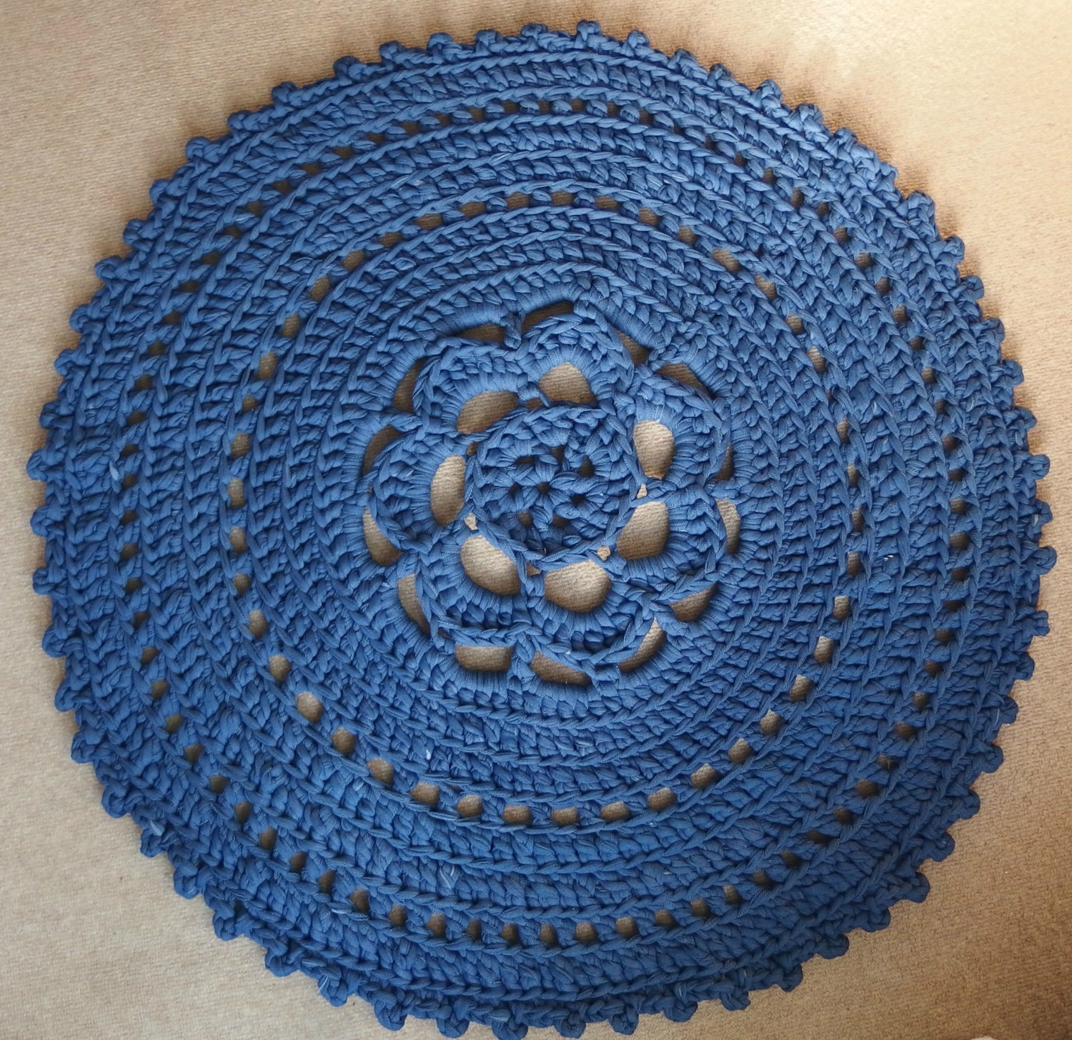 Crochet around rug of t shirt yarn in the color Denim Blue.