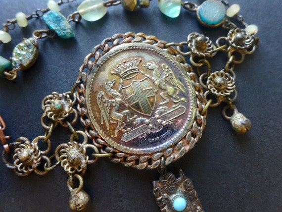 A Dream of Glory. Antique medallion assemblage bracelet with blue apatite stones.