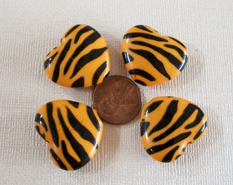 Four Lucite Orange Zebra Heart Beads