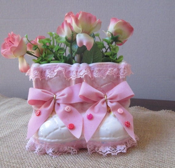 New baby girl flower arrangement in upcycled pottery baby