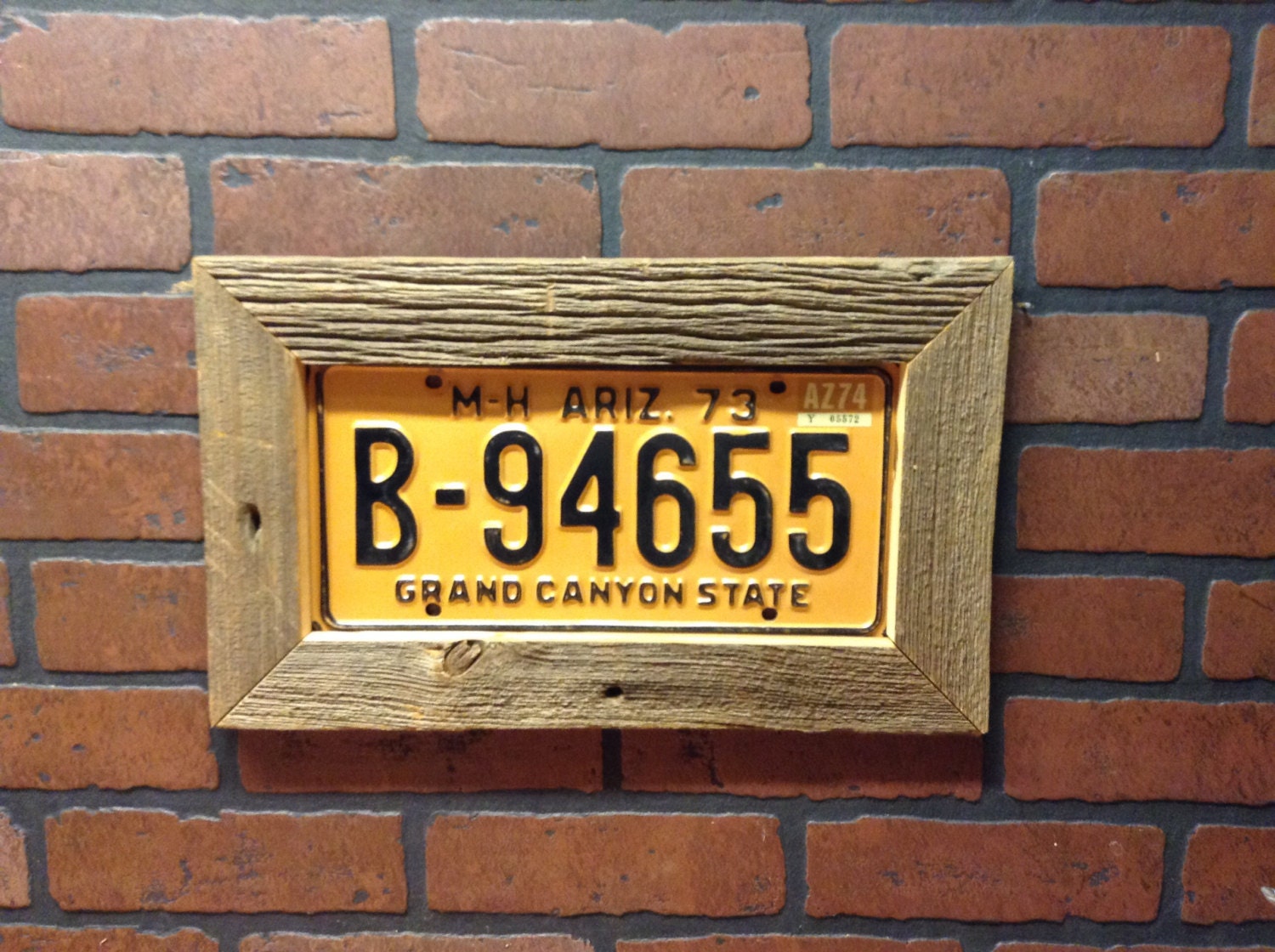Barn wood frame license plate display includes plate