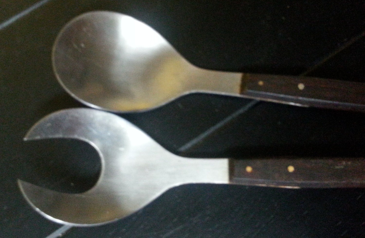 Salad fork and spoon from the 1960’s in stainless steel and dark wood