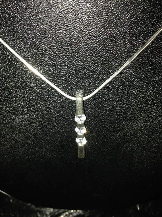 VJ signed pendant in silver with three clear cubic zirconium