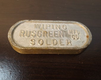 Metal Alloy Lead oval marked : Rusgreen,MFG.co.wiping solder. paper weight Gift