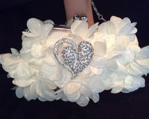 white flower clutch bag