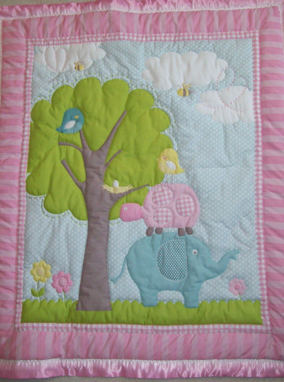Hand quilted blanket with a scene of a big tree by Quiltsquared