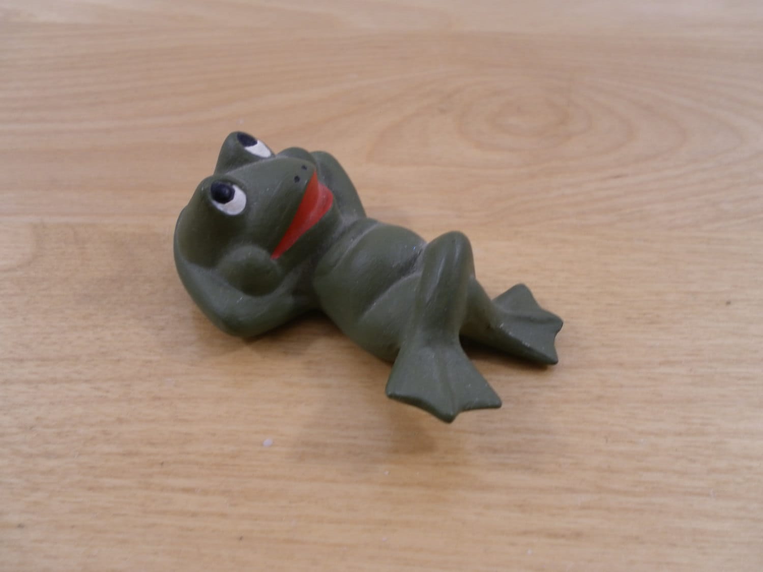 reclining frog statue