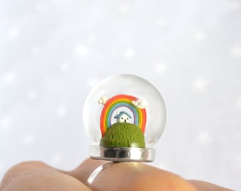Spring Terrarium ring with tiny house and rainbow. Miniature under glass globe.