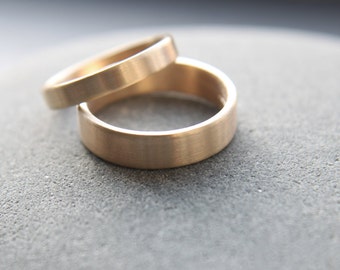 3mm + 5mm flat wedding ring set for him and her in 9ct yellow gold, brushed finish - made to order from recycled gold