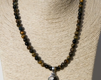 Tiger's eye beaded necklace with pendant which includes peanut jasper, tiger's eye and citrine. Bali silver toggle clasp. 16 1/2 " long