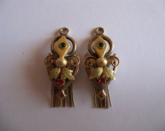 9 kt gold pendants for earrings of the Bourbon period , florentine lily with rubies and emeralds