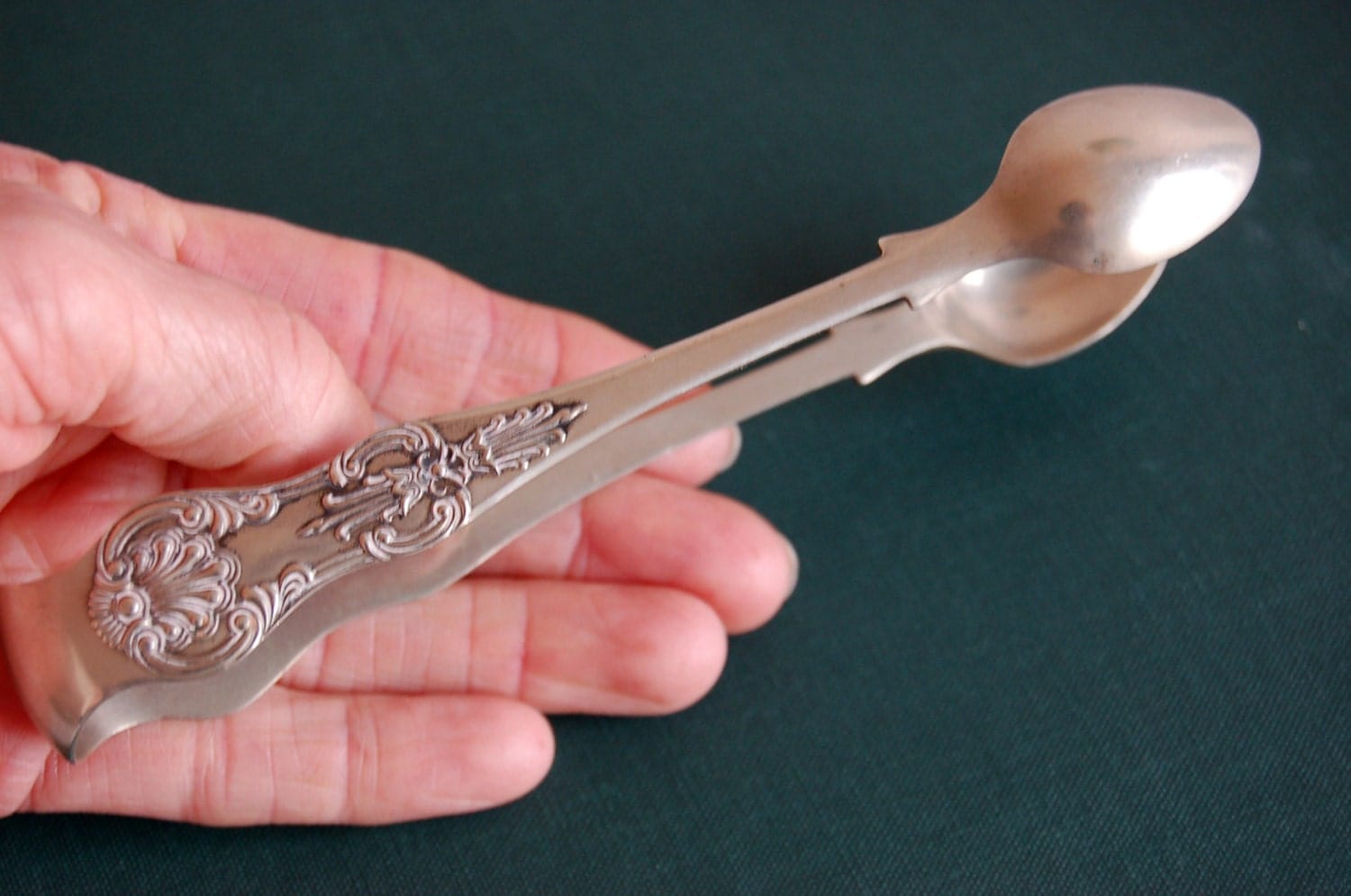 silver sugar tongs. silver plated spoon. Antique English sugar tong