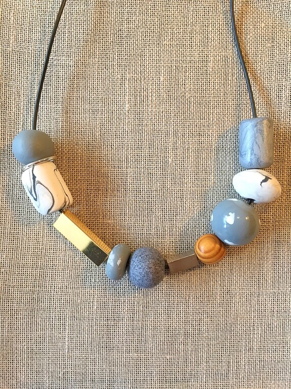 Necklace no. 1 polymer clay wood and metal by TheQuietObsession
