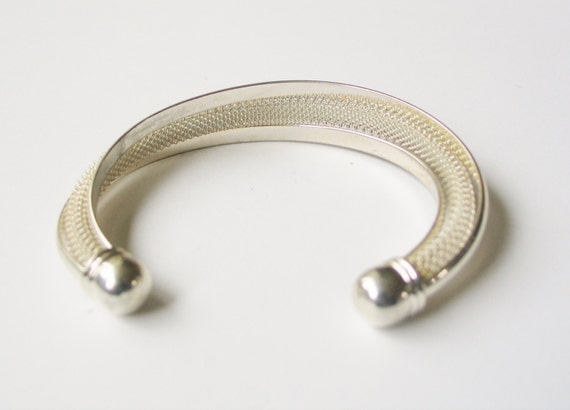Silver torc bracelet: Weighty modern take on the traditional