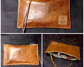 Simple Clutch made of fine leather with golden highlights