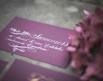 Calligraphy envelope addressing in white ink