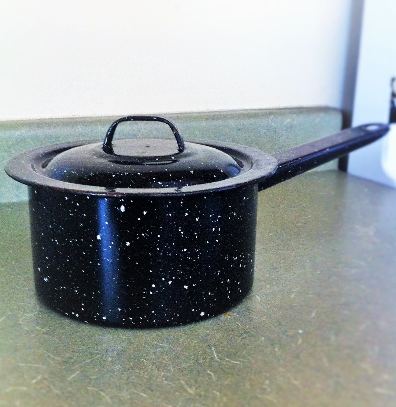 Black speckled pots and pans organizer, all clad stainless steel pan