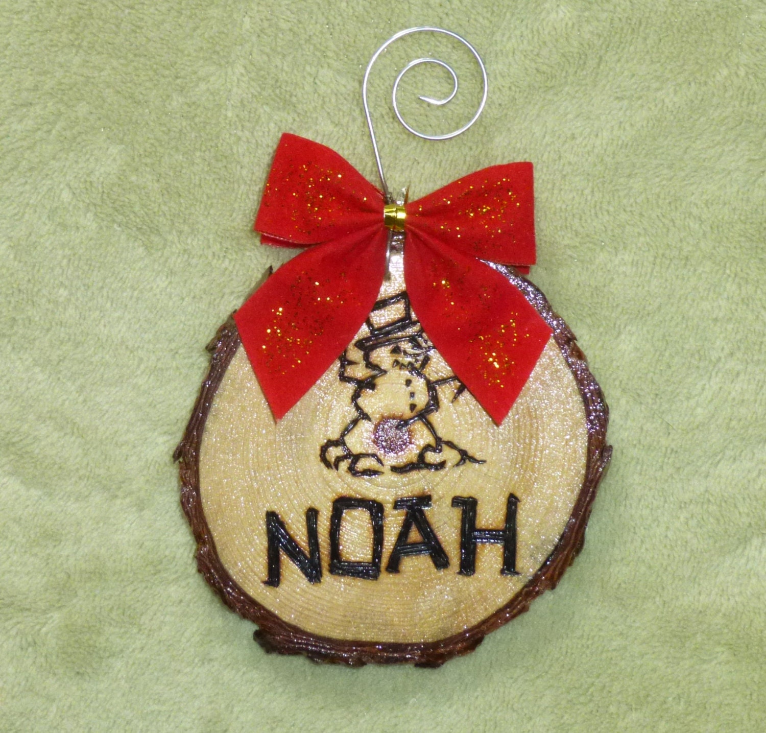 Personalized woodburned pine branch ornaments to adorn your holiday tree