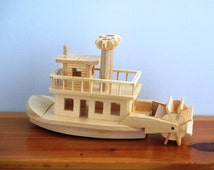 Popular items for wooden paddle boat on Etsy