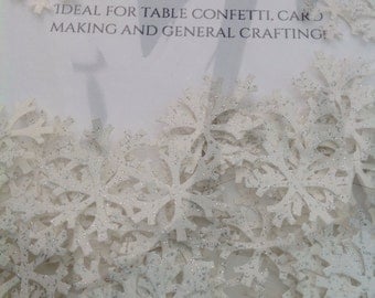 Snowflakes made from white glittered cardstock, 2cm wide. Ideal for table confetti, cardmaking and general crafting.