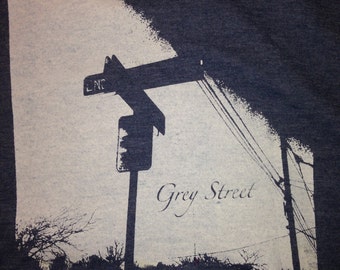 This is a shirt inspired by the Dave Matthews Band song Grey Street. We can print on any color shirt, with black or white print.