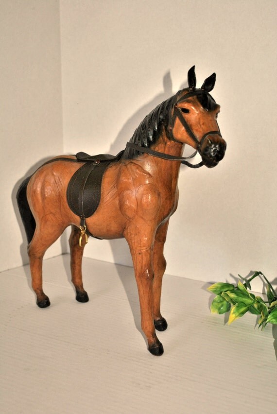 antique leather horse figurine