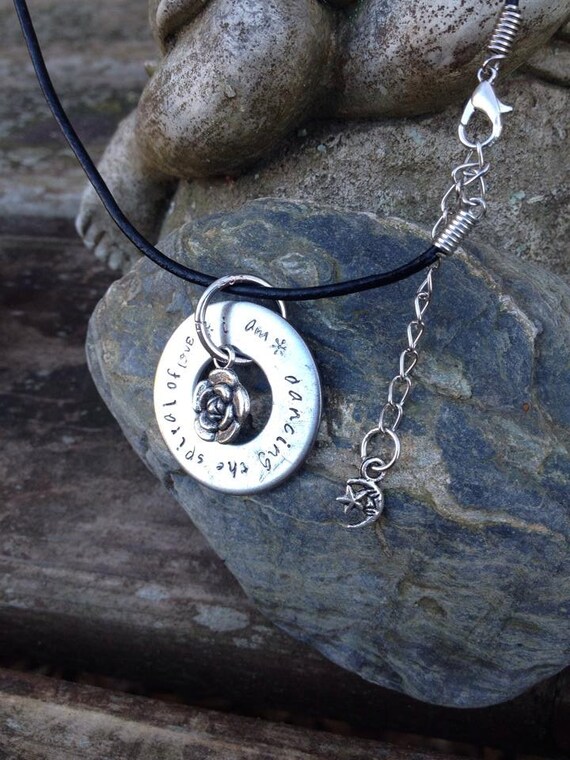 I Am Dancing the Spiral of Love: metal stamped washer style pendent necklace with black leather cord