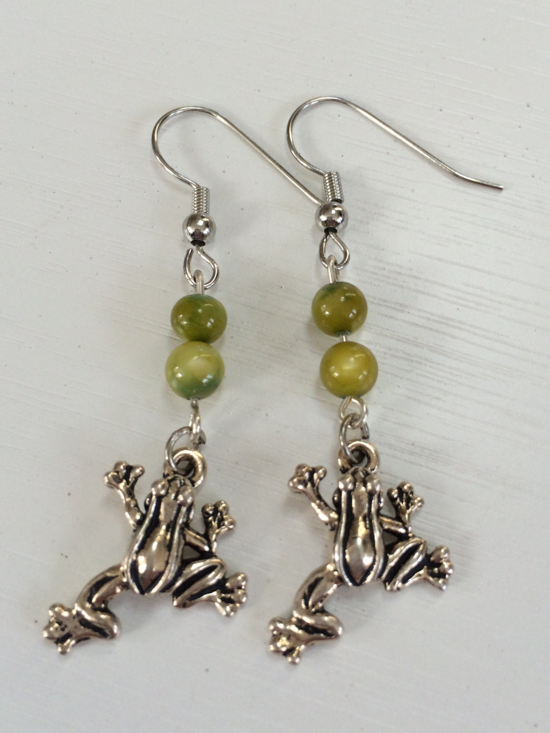 Frog earrings by madebymargie1 on Etsy