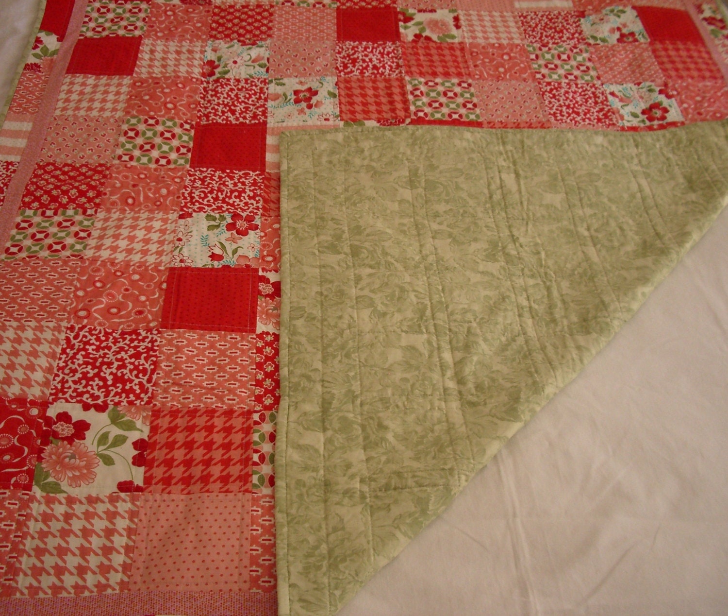 Handmade modern quilt using pink red and green fabric from
