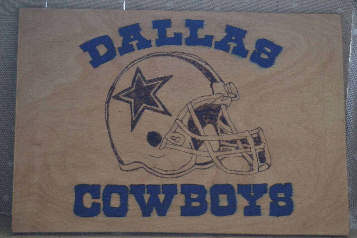 Dallas cowboys wood burning carving sculpture by Erdenwoodburning