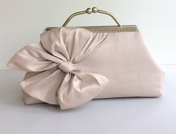 blush coloured clutch bag