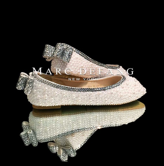 white flats with pearls