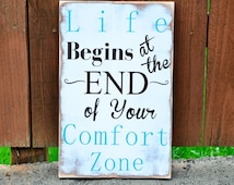 sign "life begins at the end of your comfort zone" sign