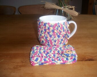 Pair of crochet mug cosies. Deep coloured random yarn .