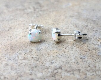 Genuine Opal 5mm(October Birthstone) stud earrings in Sterling Silver.