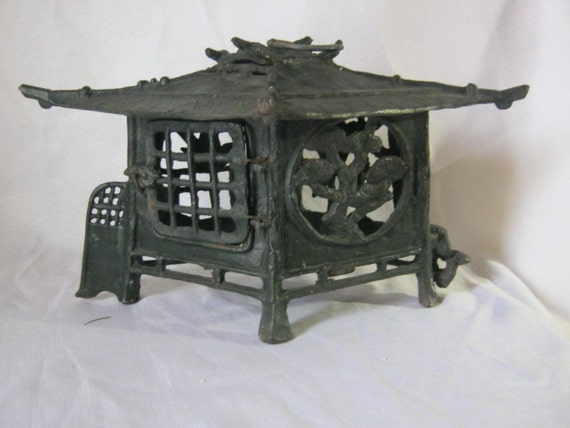 Cast Iron Pagoda Style Candle Holder Incense by yesteryeaRedux