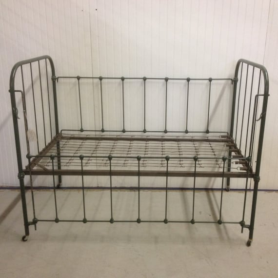 Vintage iron baby crib with springs photo by VintageThistleMarket