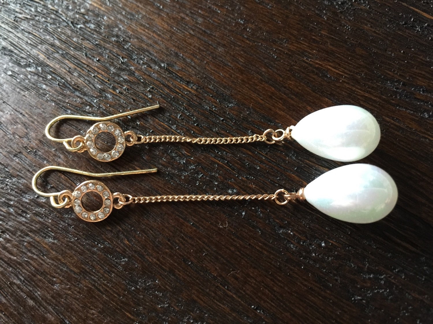 Gold dangle chain earrings large pearl suspended by long gold