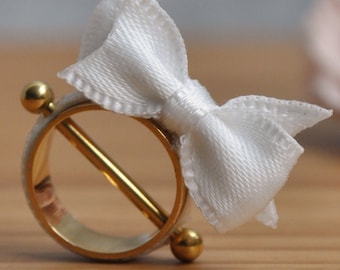 Gold Plated Nipple Piercing Cute Baby Girl with a Little White Bow.