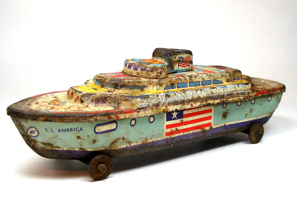 1950s Tin Toy BOAT S.S. America ship on wheels.