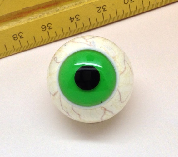 Stunning lampwork glass eyeball marble with clear green iris.