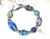 Blue charm stretch bracelet, Blue jewelry, Stretch elastic charm jewelry, Glass beaded bracelet, Gold trim glass beads